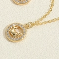 Macro detail of a gold Cancer zodiac necklace featuring a crab pendant with zircon stones - Crab Necklace (XL3128-2)