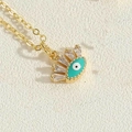 Collier doré avec pendentif œil turquoise et zircons transparents en taille baguette - Mauvais Œil Vert