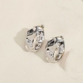 Detail of silver triangle stud earrings with molten metal texture and modern art finish - Silver Irregular Oval