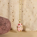 Pink enamel egg pendant necklace with red flower pattern in 14K gold plated finish - Pink (MA1-8)