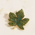 Exquisite maple leaf brooch featuring green crystals on a gold-plated alloy base - Green Marijuana Leaf
