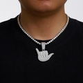 Silver iced out shaka sign pendant with tennis chain on male model in hip hop style - Silver (Tennis Chain)