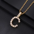 Macro shot of gold letter C pendant with pavé cubic zirconia on black leather - Letter C (Rope Chain) / Gold