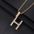 Close-up of hip hop rope chain with a gold H-letter pendant encrusted with cubic zirconia - Letter H (Rope Chain) / Gold