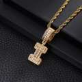 Close-up of hip-hop letter I pendant with baguette and round cubic zirconia on rope chain - Letter I / Gold