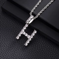 Detail of silver letter H pendant with shimmering cubic zirconia on a rope chain - H-Silver