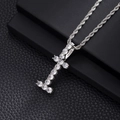 Detail view of silver cross pendant with claw-set cubic zirconia on a rope chain - I-Silver