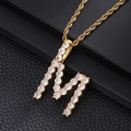 Macro shot of gold-plated letter M pendant with cubic zirconia on a rope chain - Letter M (Rope Chain) / Gold