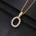 Macro detail of gold-plated rope chain necklace with iced-out pear shaped pendant - Letter O (Rope Chain) / Gold