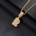 Macro shot of gold hip hop letter R pendant with sparkling cubic zirconia on a rope chain - Letter R / Gold
