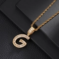 Macro detail of gold-plated G-letter pendant with pavé cubic zirconia on rope chain - Letter G (5507837524618)