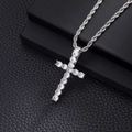 Close-up of a silver cross pendant with clear cubic zirconia on a thick rope chain - T-Silver