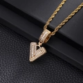 Macro detail of iced-out gold V letter pendant with pavé zircons on rope chain - Letter V / Gold