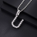 Macro shot of silver hip hop J-letter pendant with pavé cubic zirconia on rope chain - U-Silver