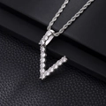 Macro detail of V-shaped silver pendant with cubic zirconia on black leather - V-Silver
