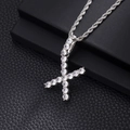 Macro shot of silver letter F pendant with pave-set cubic zirconia on a rope chain - X-Silver