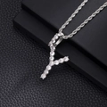 Detailed macro view of an iced out letter Y pendant necklace with rope chain and zircons - Y-Silver