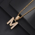 Macro shot of hip-hop letter M pendant with baguette and round zircons on rope chain - Letter M (5507837524624)