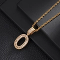 Macro detail of gold letter O pendant with baguette cubic zirconia on twist rope chain - Letter O (5507837524626)