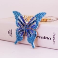 Eleganter Schmetterling Schlüsselanhänger mit blauen und lila Kristallen in Gold - Blau