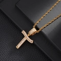 Macro shot of hip hop cross pendant with baguette cut zircons on gold twisted rope chain - Letter T (5507837524631)