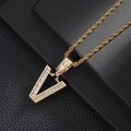 Macro shot of gold V-letter pendant with pavé cubic zirconia on twisted rope chain - Letter V (5507837524633)