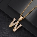 Macro shot of gold hip-hop letter W pendant with baguette-cut zircons and rope chain - Letter W (5507837524634)