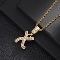 Macro detail of gold hip hop letter X pendant with square cubic zirconia and rope chain - Letter X (5507837524635)