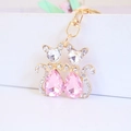 Pink crystal cat couple keychain set with gold alloy lobster clasps and rhinestone bows - Pink