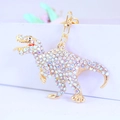 Porte-clés dinosaure mignon avec strass scintillants pour sacs à main et clés de voiture - Emballage individuel en sac OPP / Blanc AB