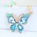 Llavero de mariposa con cristales azules y cierre de mosquetón dorado para bolsos mujer - Azul