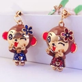 Cute cartoon monkey earrings with floral detail in red and blue enamel finish - Random Color