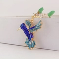 Porte-clés colibri exquis avec cristaux bleus et finition en alliage doré - Bleu foncé