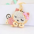 Cute golden cat keychain with sparkling pink and white rhinestones and flower charm - Pink