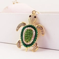 Portachiavi a forma di tartaruga marina dorata con strass verdi e bianchi lucidi - Verde