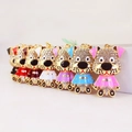 Lot de sept porte-clés chien en cristal coloré avec des strass brillants et dorés - Couleur Aléatoire