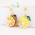 Sparkling orange and lemon fruit slices keychain with rhinestones on gold metal base - Random Color