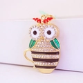 Sparkling owl in cup keychain with white rhinestones and a red enamel bow detail - Black