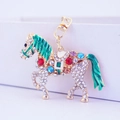 Golden horse keychain with white rhinestones and multi-colored gemstones and green enamel - Green