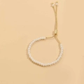 Detail of 14K gold plated bracelet featuring white pearls and adjustable slider clasp - 4mm Pearl (SL0205-1)