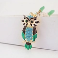 Exquisite owl keychain with blue rhinestones and green enamel on a gold alloy frame - Blue