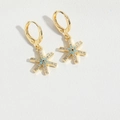 Detailed macro view of gold star hoop earrings with crystal pavé and blue eye design - Snowflake Star (ES2724-2)