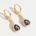Detailed macro view of vintage gold earrings with blue gemstone and swan relief - Water Drop (ES2724-3)