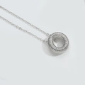 Silver-colored necklace featuring a crystal-encrusted donut-shaped pendant on a delicate chain - Letter O