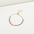 Pulsera dorada ajustable con piedras de circonita multicolor sobre fondo blanco - Multicolor SL3472