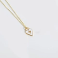 Abstract retro gold necklace featuring a white enamel heart pendant with cutout design - Gold Necklace White Heart Pendant / White Heart