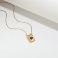 Vintage gold Devil's Eye necklace with a rectangular eye pendant on a minimalist background - Brown
