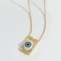 Detailed close-up of retro golden square pendant necklace with evil eye design - Blue