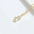 Gold choker necklace with evil eye beads and crescent moon charms in an exotic style - Blue Eye
