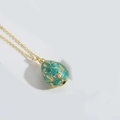 Vintage egg pendant necklace with lake green enamel and golden floral patterns - Green